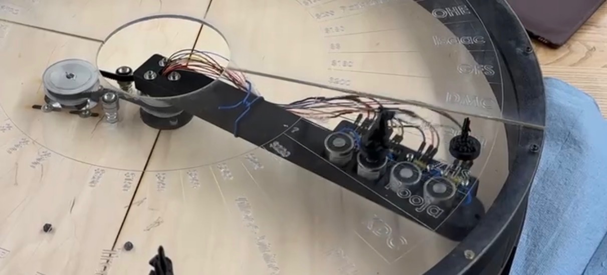 Bartholomew Banksworth's lever arm consisting of a belt-and-pulley system, a slip ring, and electromagnets