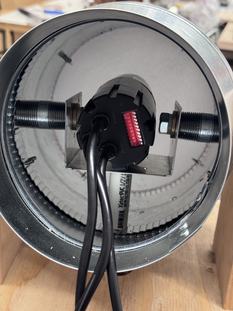 The light housing was made using off-the-shelf HVAC ducts. The pivot was made using off-the-shelf parts intended for auto and plumbing applications.